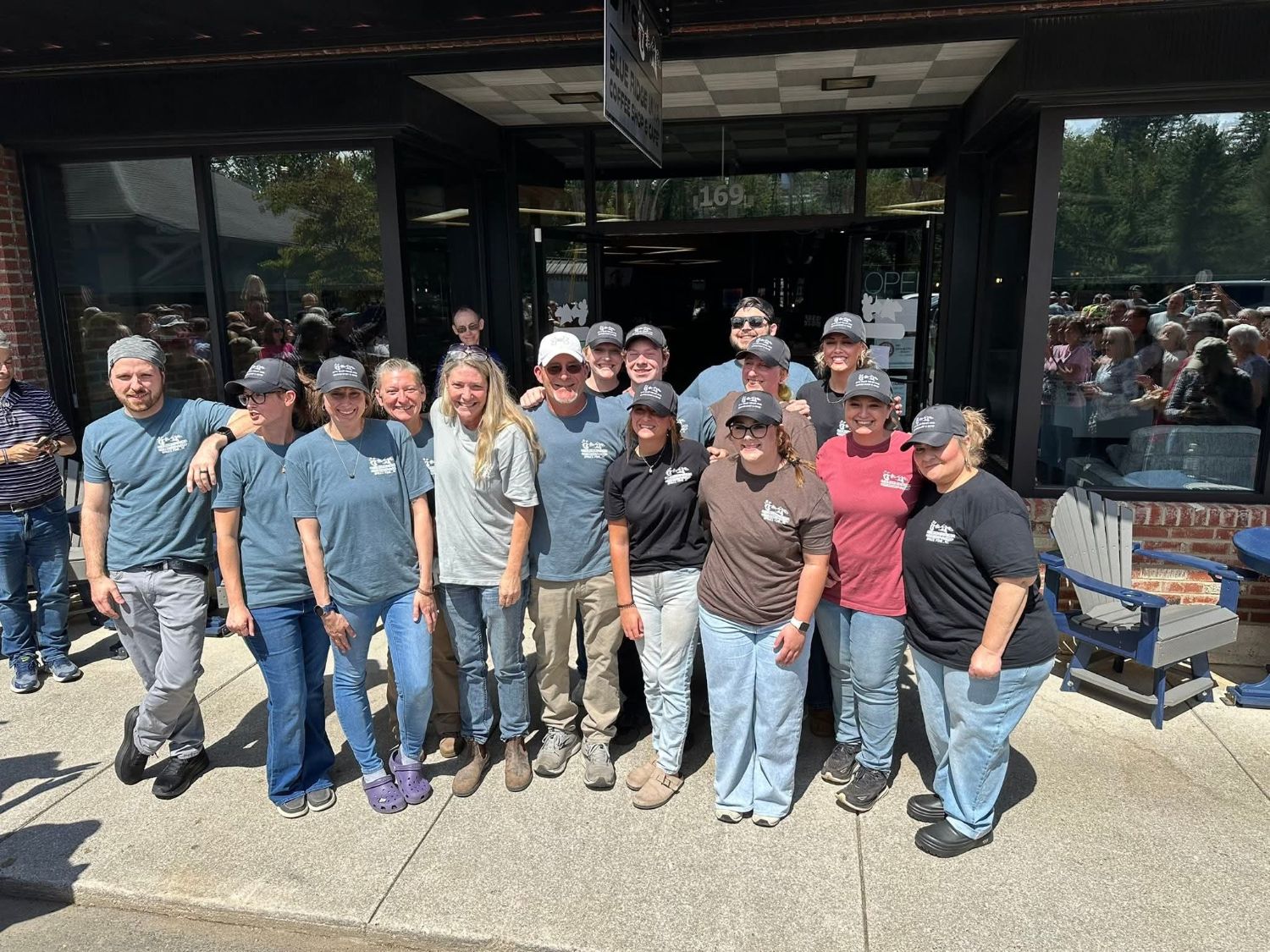 The DT's crew in matching shirts and caps outside the café on reopening day