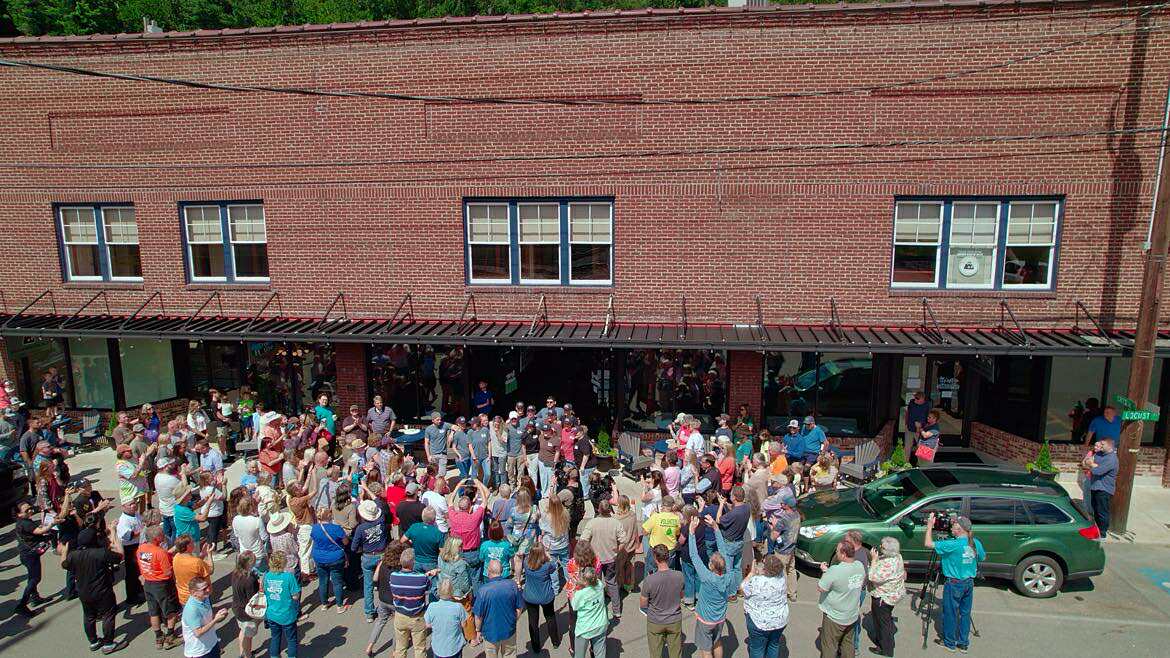 Aerial view of a huge crowd gathered outside the Wylie Building on reopening day, Aug 27, 2025